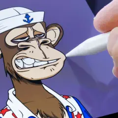 Ein digitaler Künstler bearbeitet einen **nft bored ape** mit einem Stift auf einem Tablet. Der Affe trägt eine Matrosenmütze und ein Hemd mit Sternen.