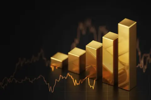 Goldbarren steigen an, eine positive Gold prognose 2030, vor einem Chart.